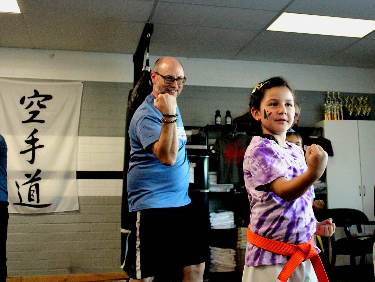 Kids karate class lined up on the mat at Kombat Karate Long Beach
