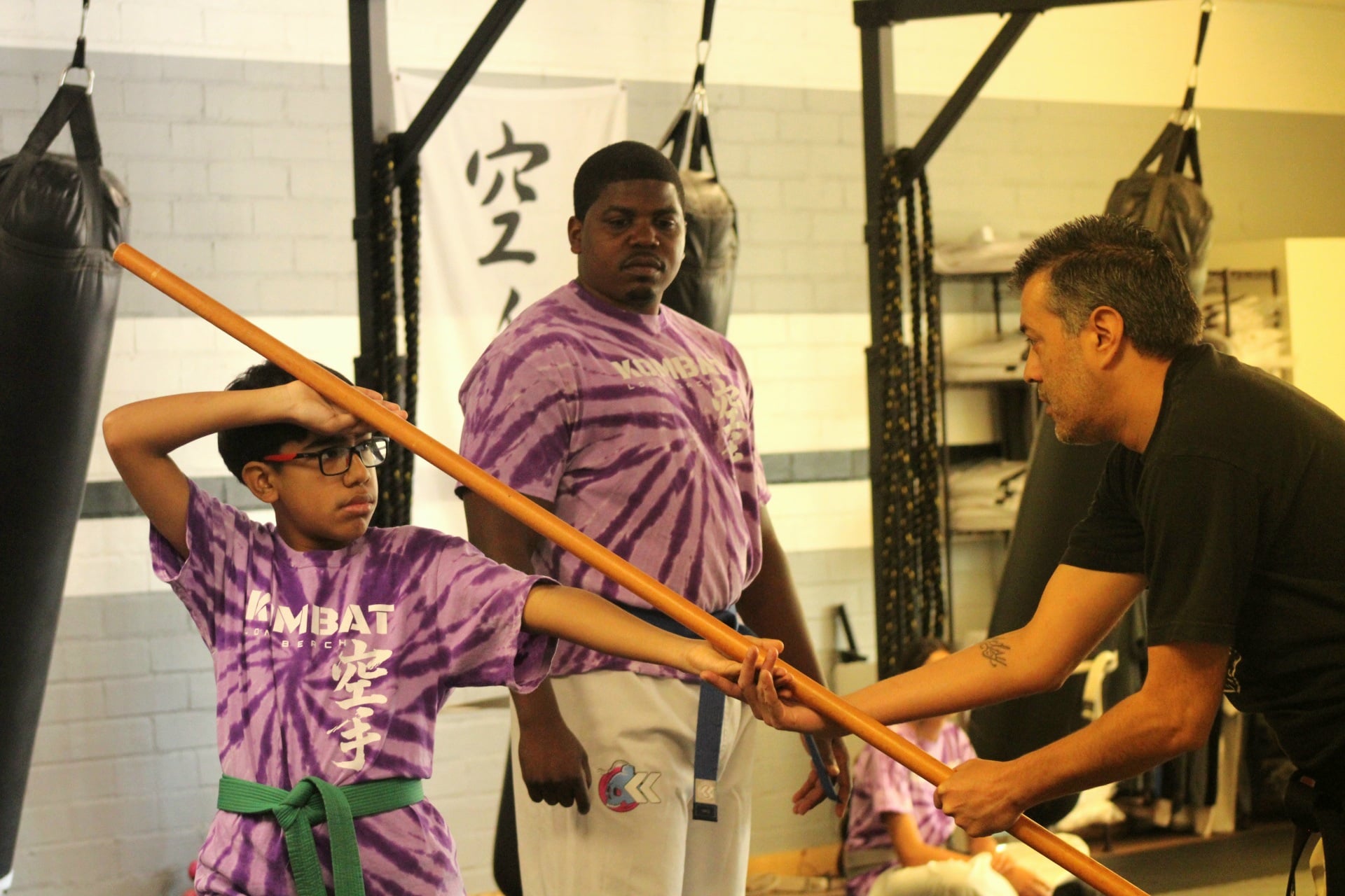 Teen karate student holding a strong front stance during class in Long Beach