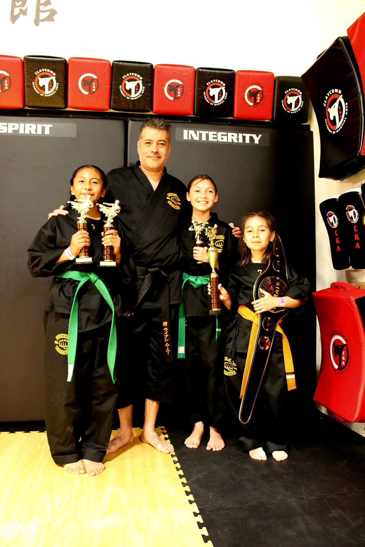 Kombat Karate students in gis posing for a class photo in Long Beach