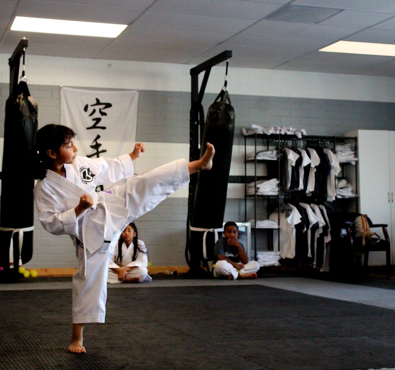 Adult karate students practicing partner drills in Long Beach, CA