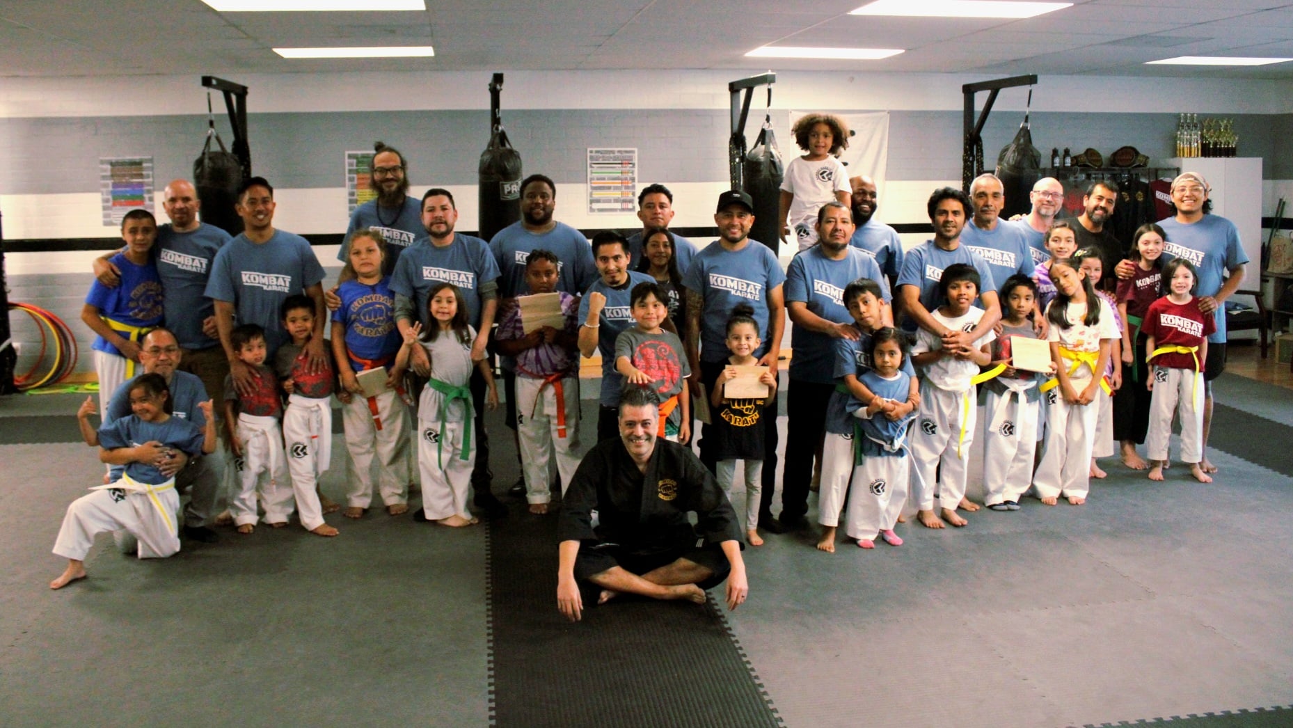 Instructor coaching students on technique at the Long Beach dojo