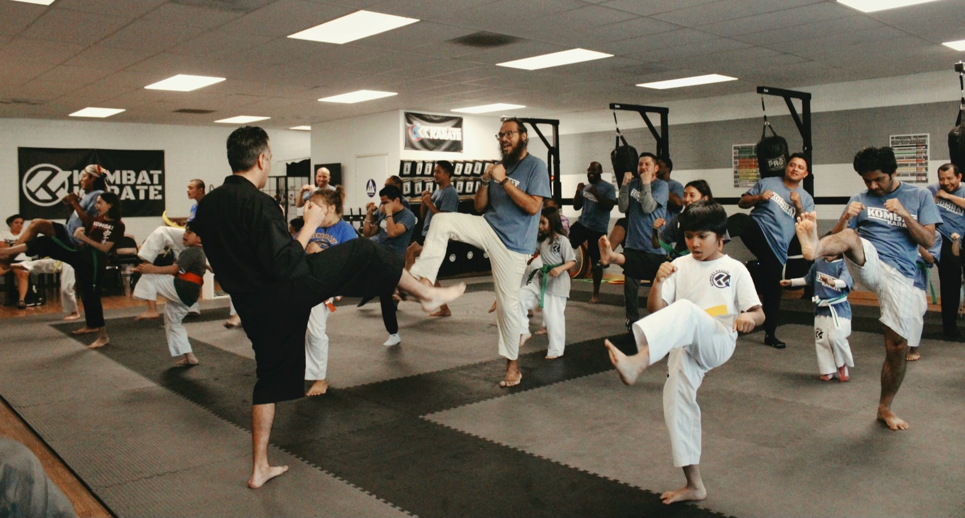 Kids karate warm up drills at Kombat Karate Academy in Long Beach