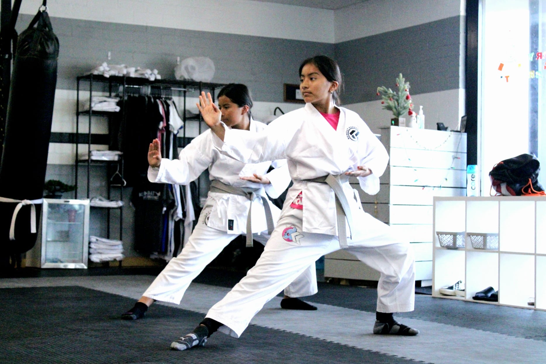 Instructor demonstrating a punch to a karate class in Long Beach, CA